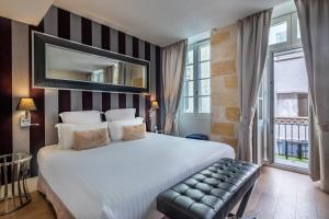 a hotel room with a large bed and a window at Le Boutique Hotel & Spa in Bordeaux +38 photos