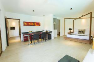 Ένα ή περισσότερα κρεβάτια σε δωμάτιο στο Aliya Resort and Spa - Thema Collection