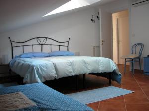 เตียงในห้องที่ B&B L'Umbra di lu Soli