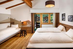 Postel nebo postele na pokoji v ubytování Hotel Blinnenhorn
