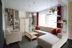 a living room with a couch and a table at Nebelstation in Wustrow