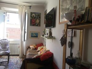 a living room with a couch and a window at Piazza Bologna via Stamira 74 interno 12 Vita Felice in Rome