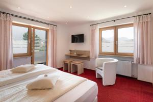 Postel nebo postele na pokoji v ubytování Hotel Garni Bergidyll - adults only