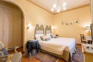Postel nebo postele na pokoji v ubytování Hotel Villa Marsili