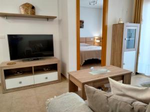 Televízia a/alebo spoločenská miestnosť v ubytovaní ACV - Valparaiso - 2ª linea planta 9 norte