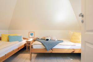 Llit o llits en una habitació de Haus Bullerbü