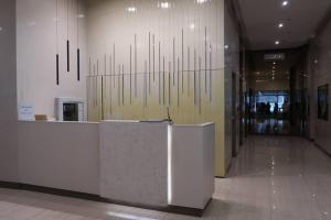 a lobby with a reception desk in a building at "Stylish Loft Condo with High-Speed WiFi at Avida Towers" in Davao City +16 photos