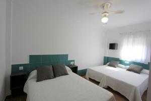 Łóżko lub łóżka w pokoju w obiekcie Apartamento Mercedes Céntrico Playa