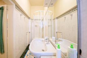 a bathroom with a sink and a bath tub at DolceVita Apartments N. 490 in Venice