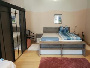 a small bedroom with a bed and a balcony at Rohrbacher Hof in Berg bei Rohrbach