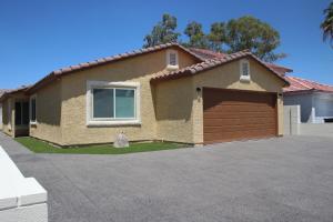 a brown house with a brown garage at Newly Remodeled Family Friendly 3B/2B House in Henderson