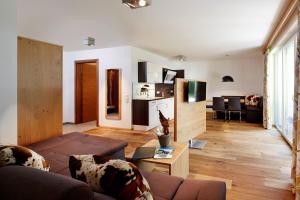 a living room with a couch and a table at Apartment S in Ehrwald