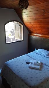 A bed or beds in a room at Pousada Portal de Lumiar