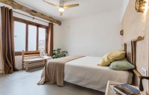 a white bedroom with a bed and a window at Encantadora casa rural con piscina privada in El Bosque +14 photos