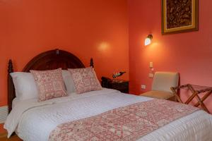 Voodi või voodid majutusasutuse Rincón Familiar Hostel Boutique toas