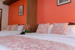 Voodi või voodid majutusasutuse Rincón Familiar Hostel Boutique toas