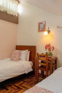 Voodi või voodid majutusasutuse Rincón Familiar Hostel Boutique toas