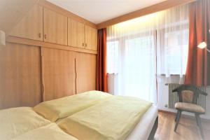 Posteľ alebo postele v izbe v ubytovaní Residence Tantalus