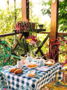 a table with croissants and pastries on top of it at Casa Serra Negra in Bezerros