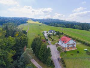 an aerial view of a large house in a field at Leśne Zacisze in Weremień