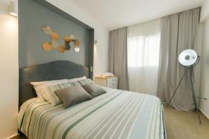 Ένα ή περισσότερα κρεβάτια σε δωμάτιο στο My Cosy Place Rabat - Appartements Argane Hay Riad