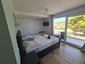 a bedroom with a bed and a large window at Villa Patricia in Stari Grad +61 photos