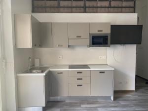 A kitchen or kitchenette at Monolocale Agata Még 15 kép