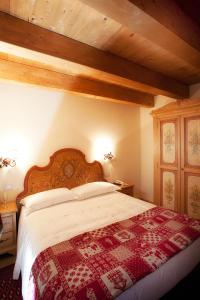 Postel nebo postele na pokoji v ubytování Garnì Astoria Hotel & SPA