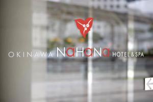 a sign on a window of a building at Okinawa NaHaNa Hotel & Spa in Naha +158 photos