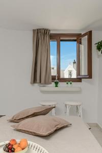 Posteľ alebo postele v izbe v ubytovaní Geolenas Home - Naxian Old Agora