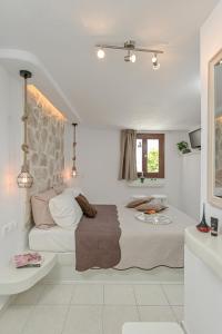 Posteľ alebo postele v izbe v ubytovaní Geolenas Home - Naxian Old Agora