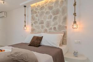 Posteľ alebo postele v izbe v ubytovaní Geolenas Home - Naxian Old Agora