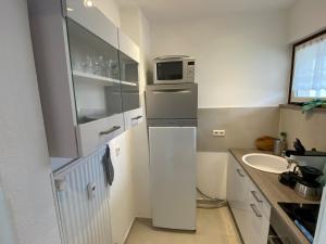 Kuchyň nebo kuchyňský kout v ubytování Apartment Harzblick -NEU MODERNISIERT-