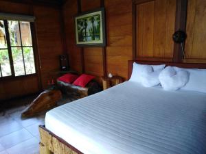 A bed or beds in a room at Estancia La Colina