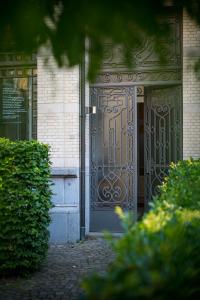 an entrance to a building with a metal door at Garden of Eden in Antwerp