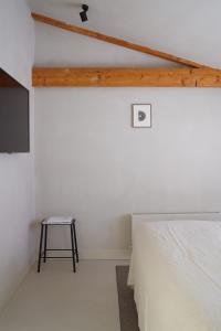 Postel nebo postele na pokoji v ubytování Hotel âme