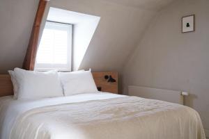Postel nebo postele na pokoji v ubytování Hotel âme