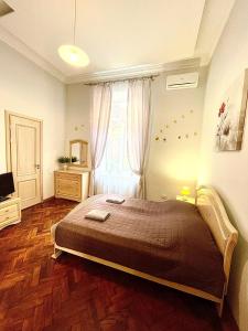 Кровать или кровати в номере 3 rooms apartments in the city centr