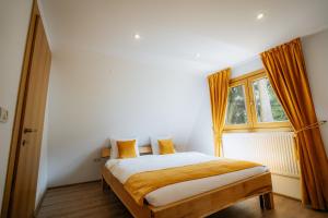 Ένα ή περισσότερα κρεβάτια σε δωμάτιο στο Livada 45 II