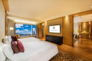 Postel nebo postele na pokoji v ubytování Hotel Okura Macau