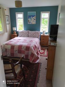 A bed or beds in a room at B&B Higher Quantock