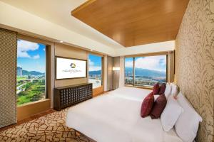 Voodi või voodid majutusasutuse Hotel Okura Macau toas