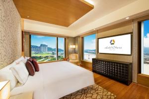 Voodi või voodid majutusasutuse Hotel Okura Macau toas