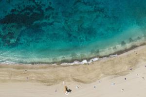 an overhead view of a beach with people on it at Home2Book Sea Front Vista Marina, Los Cristianos in Arona