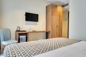Кровать или кровати в номере Eleven Inn Tbilisi