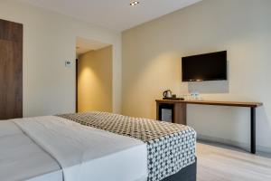 Кровать или кровати в номере Eleven Inn Tbilisi