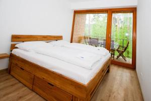 Posteľ alebo postele v izbe v ubytovaní Lipnoport Lakeside Apartment