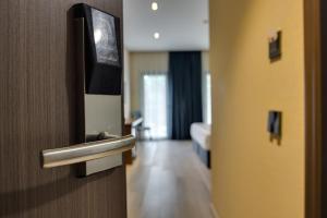 Телевизор и/или развлекательный центр в Eleven Inn Tbilisi