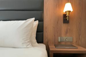 Кровать или кровати в номере Eleven Inn Tbilisi