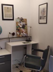a desk with a chair and a lamp in a room at La Solitaire in Saint-Jean-aux-Bois